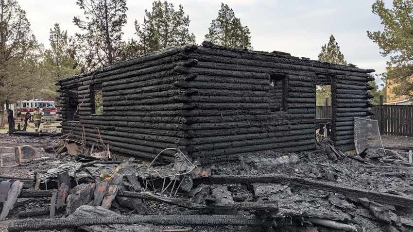 Dog awakens Crooked River Ranch resident who escapes fire that destroyed log home