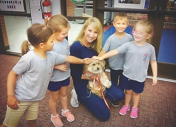 Jeanie the three-legged dog and owner Lydia Crochet make some new friends.